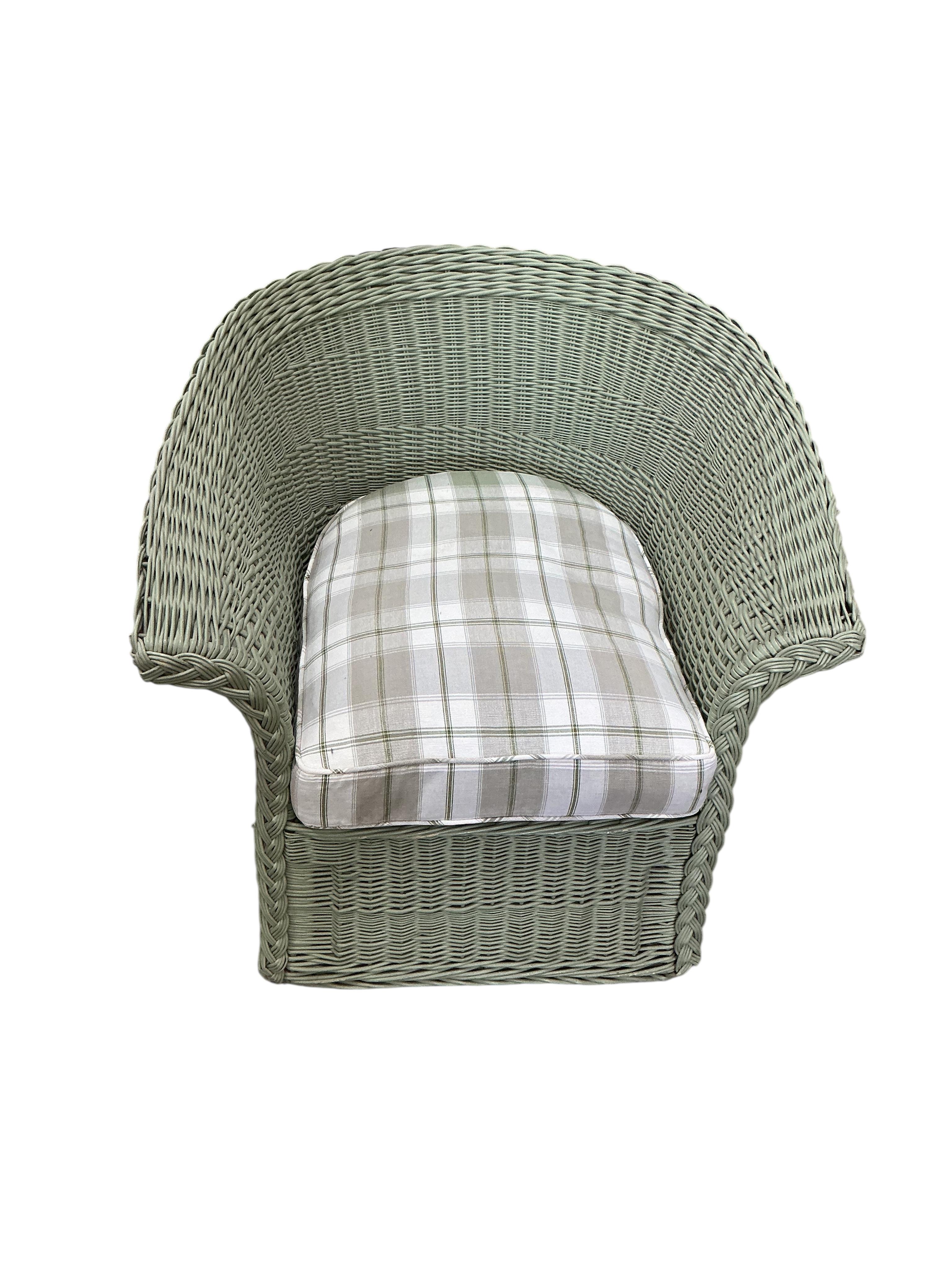 A Contemporary green wicker conservatory suite, comprising three seater settee, armchair, footstool and tray top table